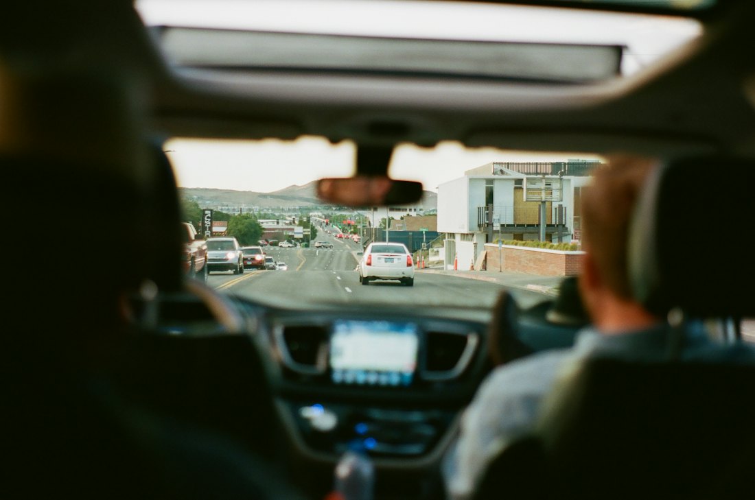 View from the back seat of a car on the road